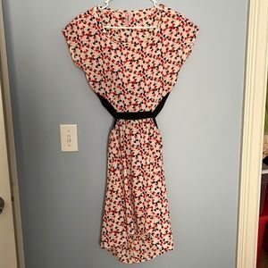 Unique fun dress with cutout in back.